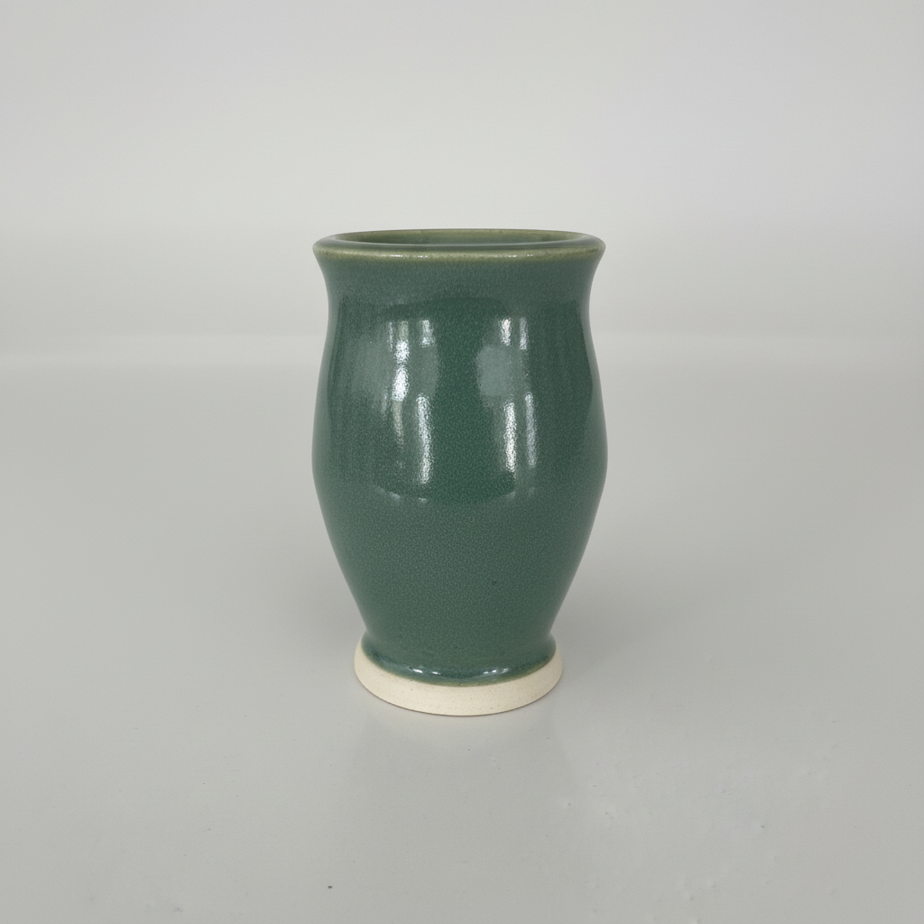 Side angle view of green ceramic vase