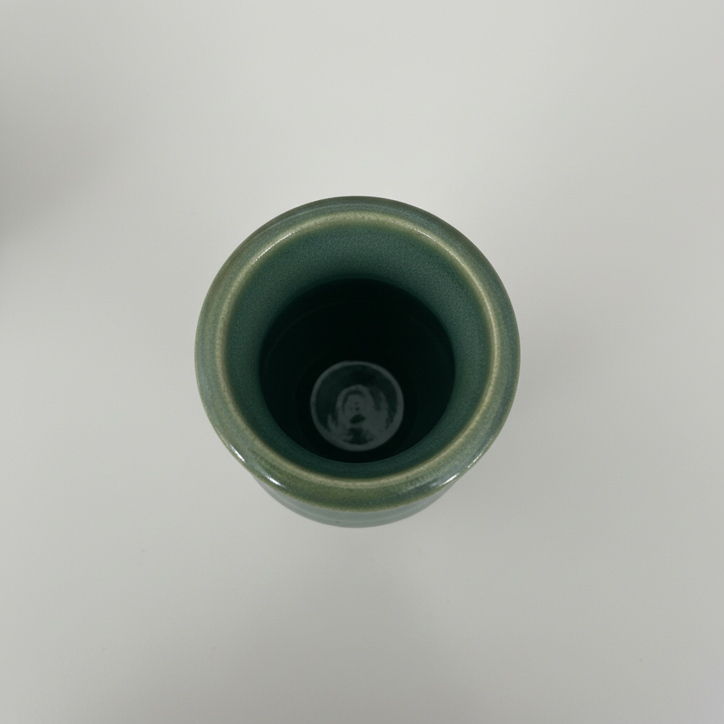 Top-down view of green ceramic vase
